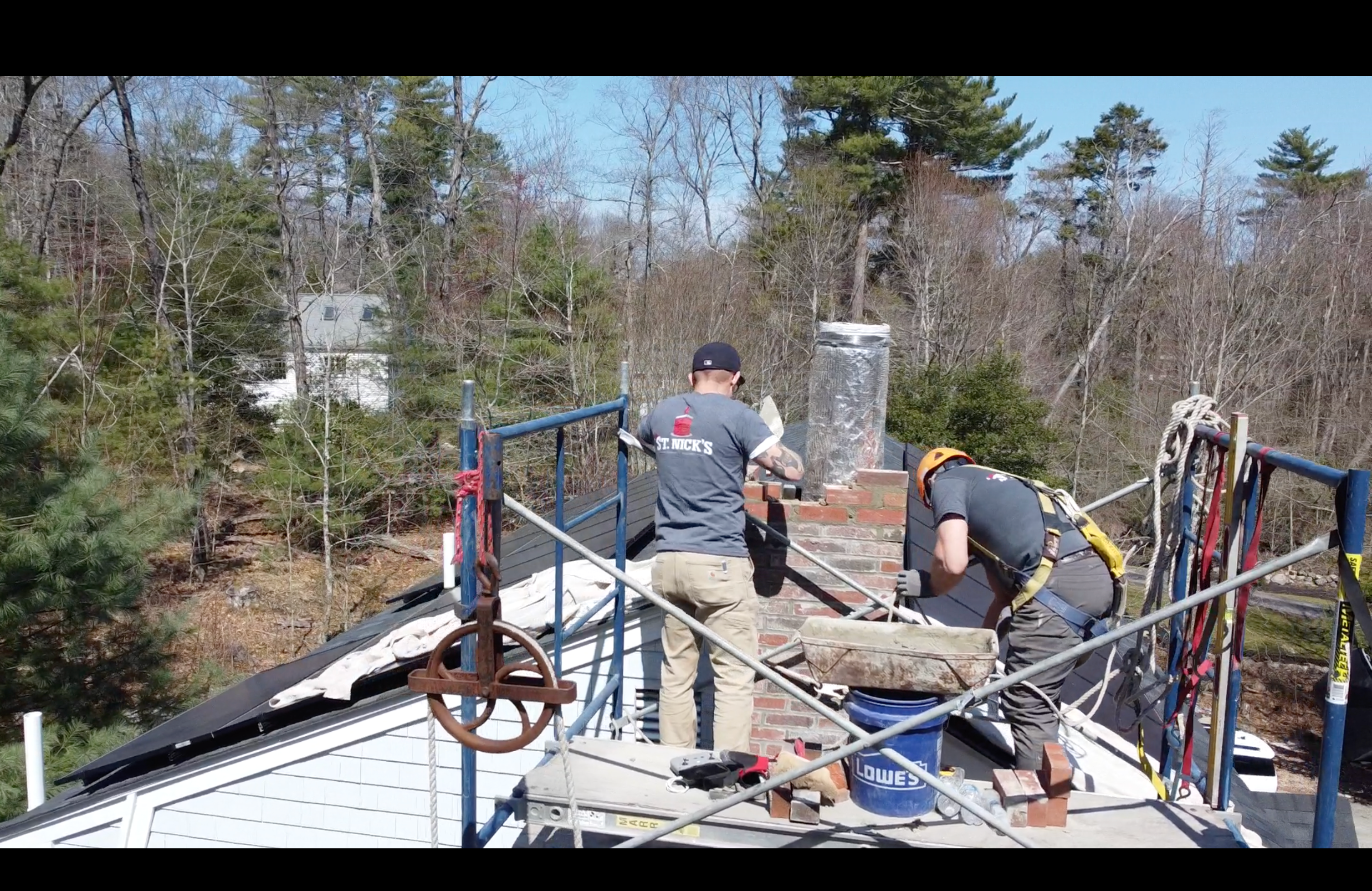 St. Nick’s Chimney Service team repairing a brick chimney on a Weymouth home
